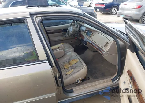 2005 Mercury Grand Marquis из США, поврежденный, VIN 2MHFM75W35X647751